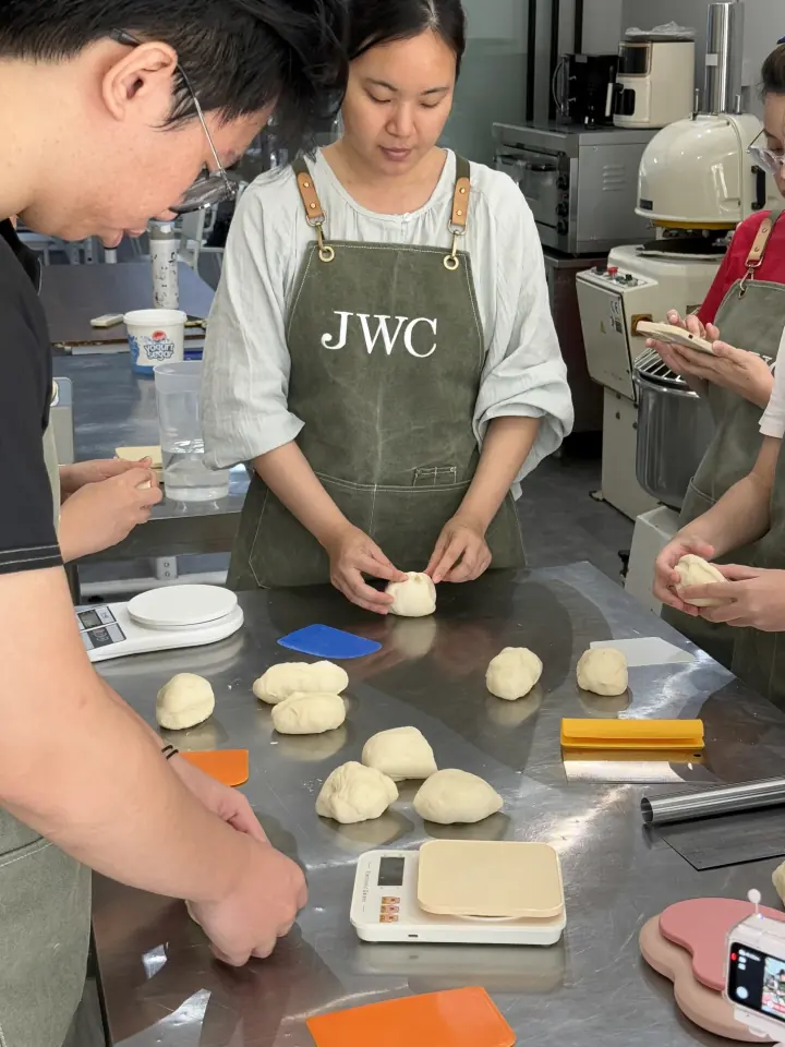 JWC Academy baking students learning to read and handle dough