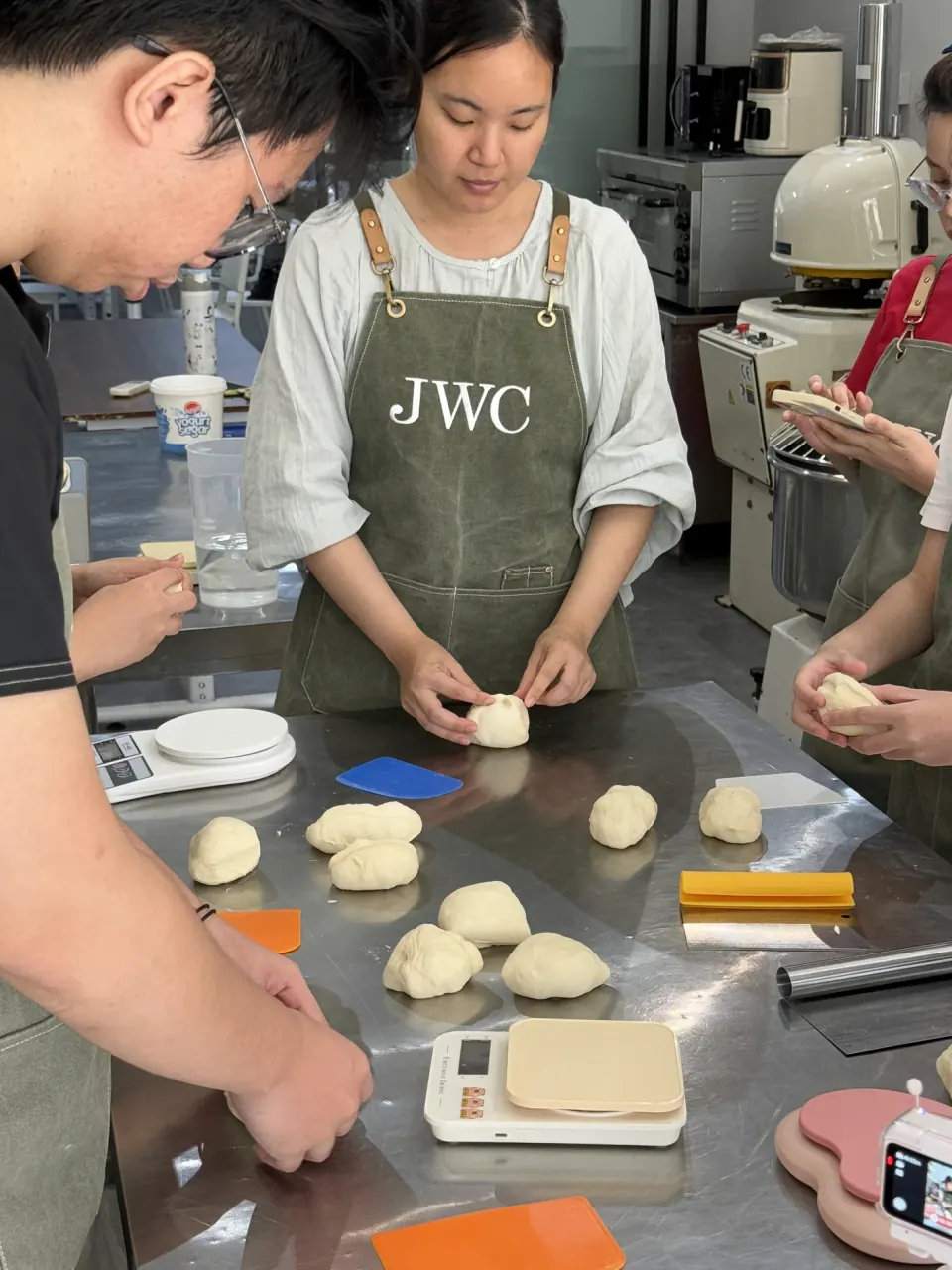 JWC Academy students practicing bread dough shaping