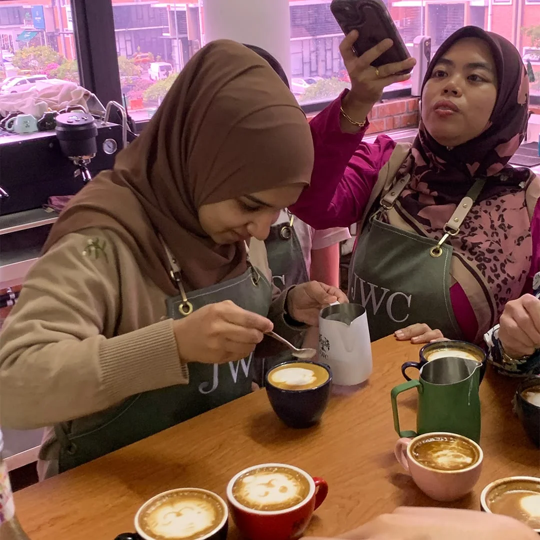 Students practising together in a JWC Academy coffee classroom
