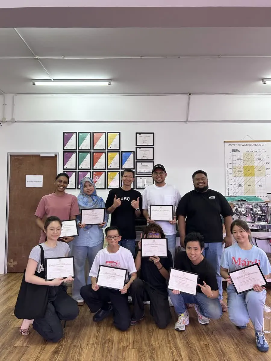 JWC Academy coffee graduates together in the classroom