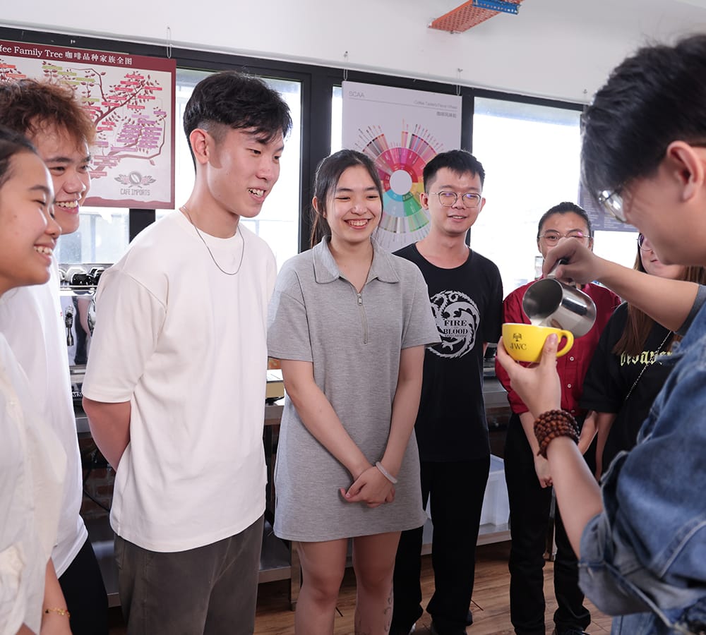 JWC Academy students watching a live milk-pouring demonstration