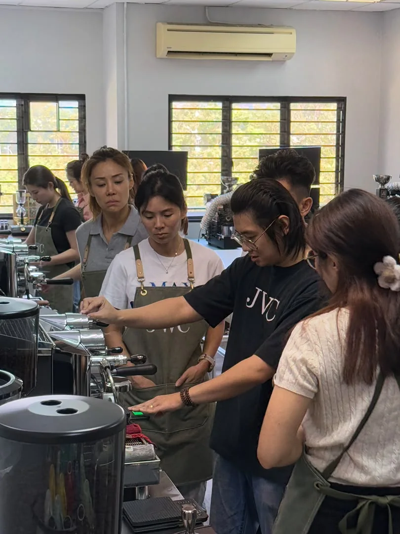 JWC Academy student practising espresso extraction at the coffee machine